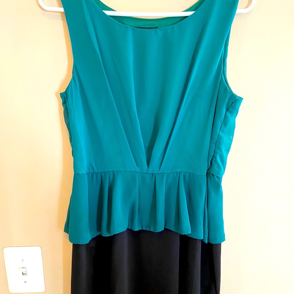 Green and black peplum dress